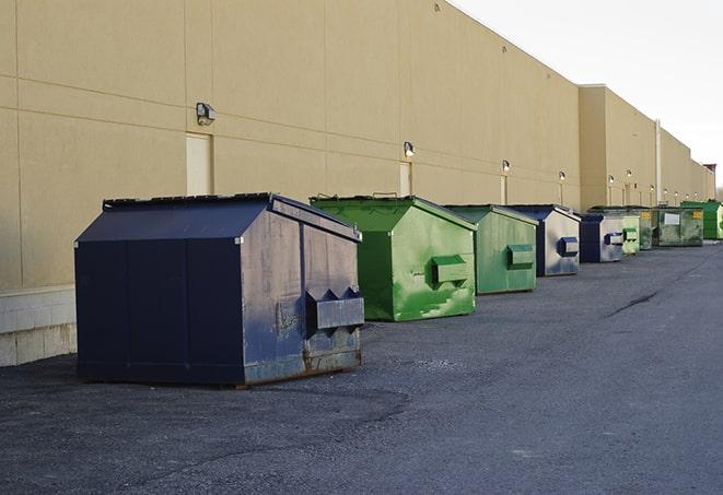 metal waste containers sit at a busy construction site in Beverly Hills MI